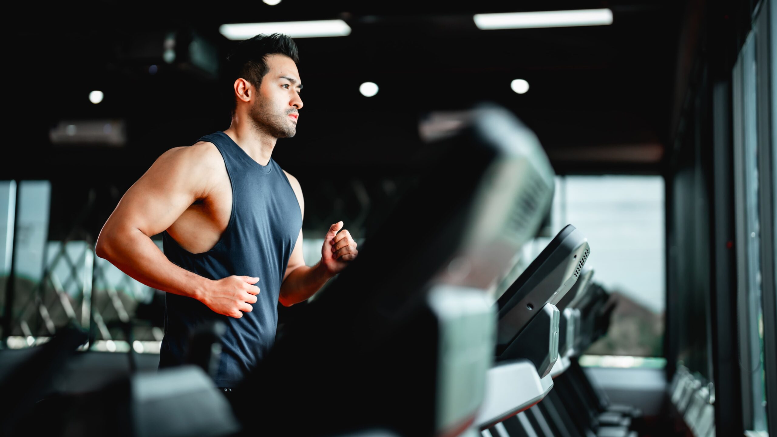 A man in a gym trying sports