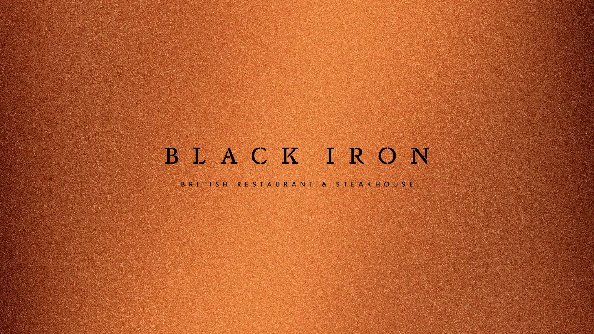Black Iron logo on a copper metallic background