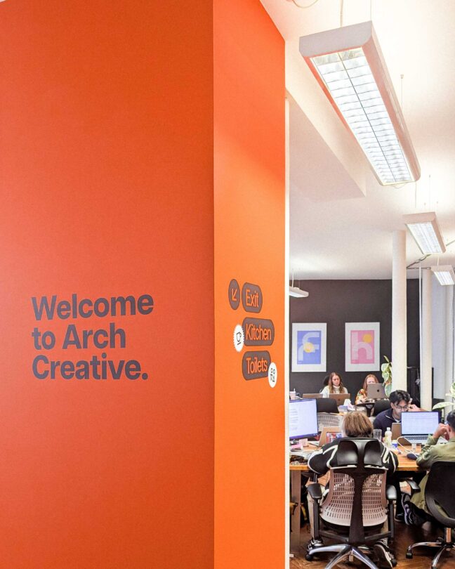 Signage on our big orange pillar welcoming guests to the Arch Studio