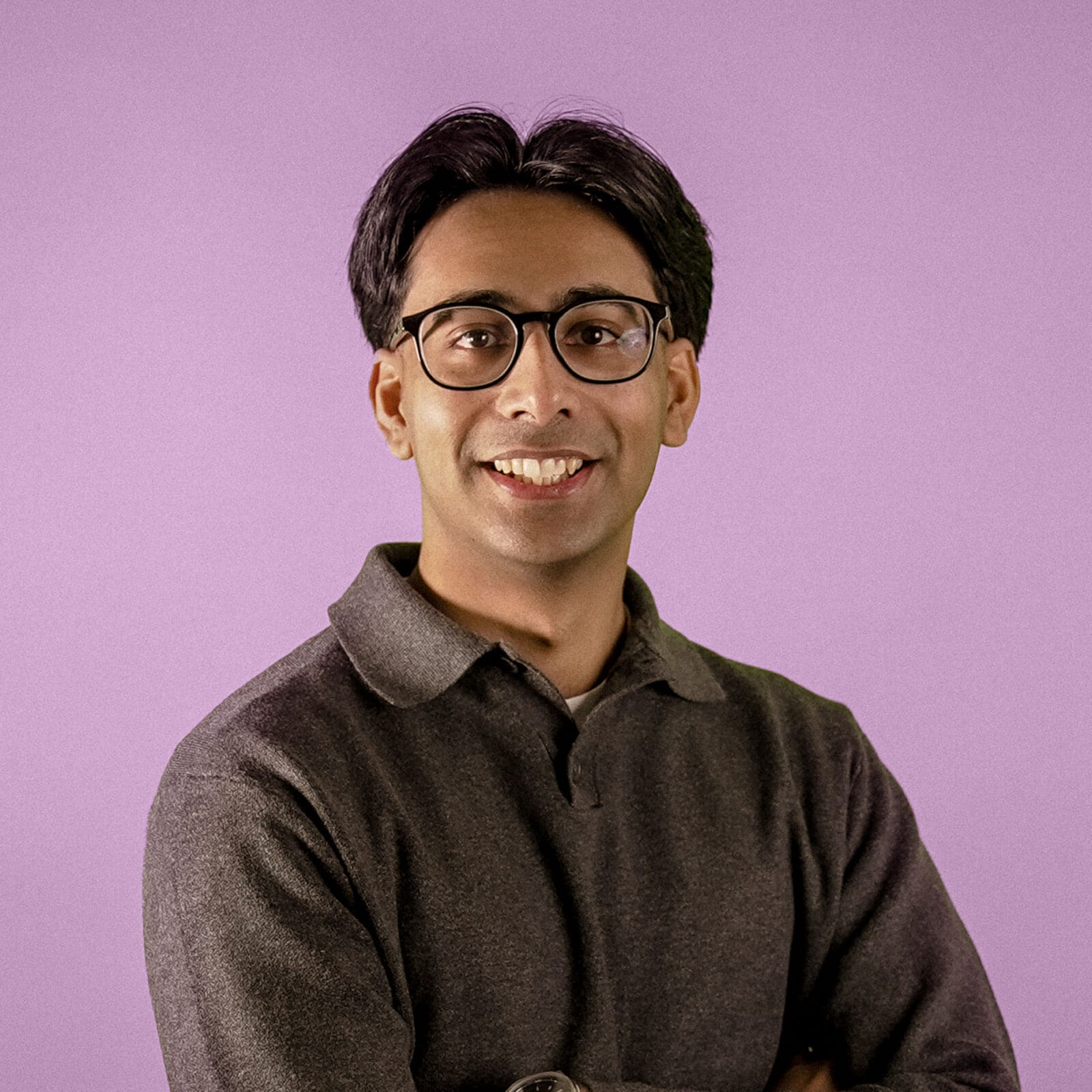 Headshot of Tarren Parmar, Designer, on pink background